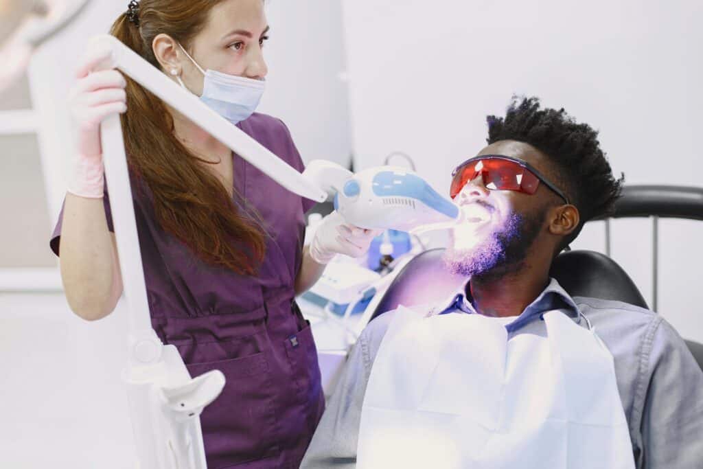 Professional teeth whitening treatment using LED light during training in Utah