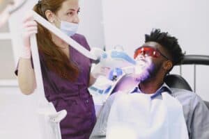 Professional teeth whitening treatment using LED light during training in Utah